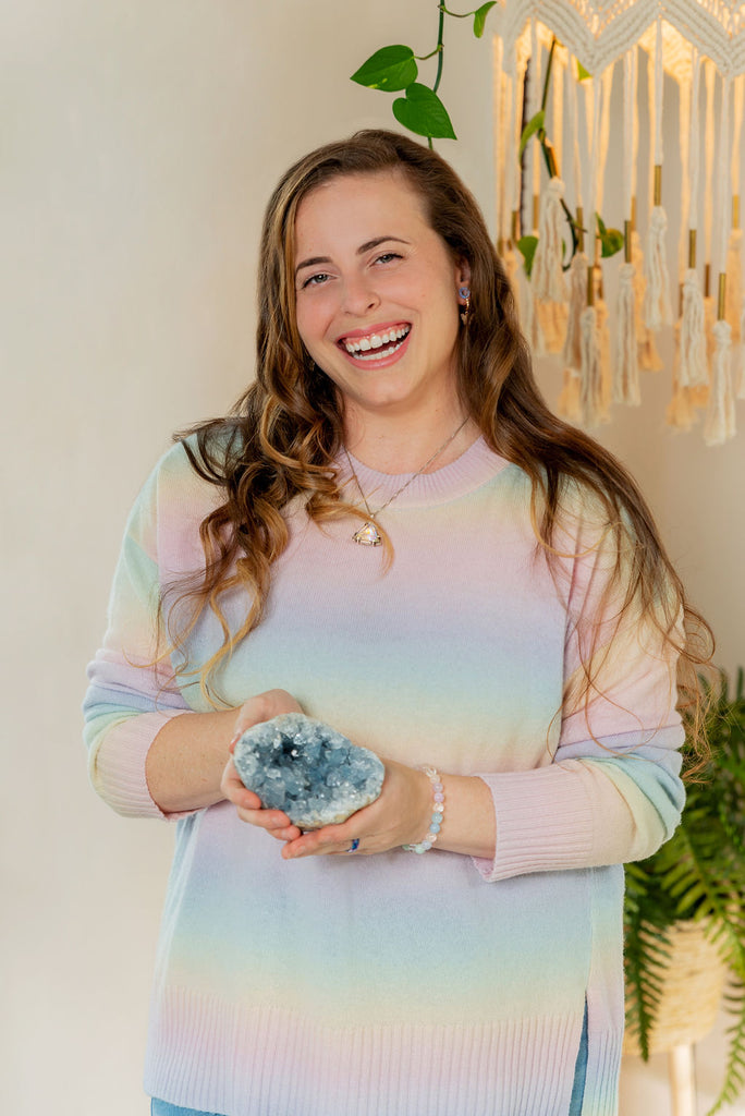 Brooke of May the Quartz Be with You holding celestite geode